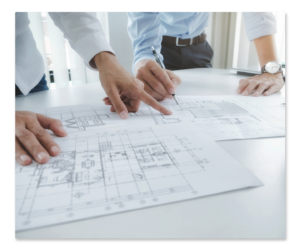 Two architects reviewing a building plan